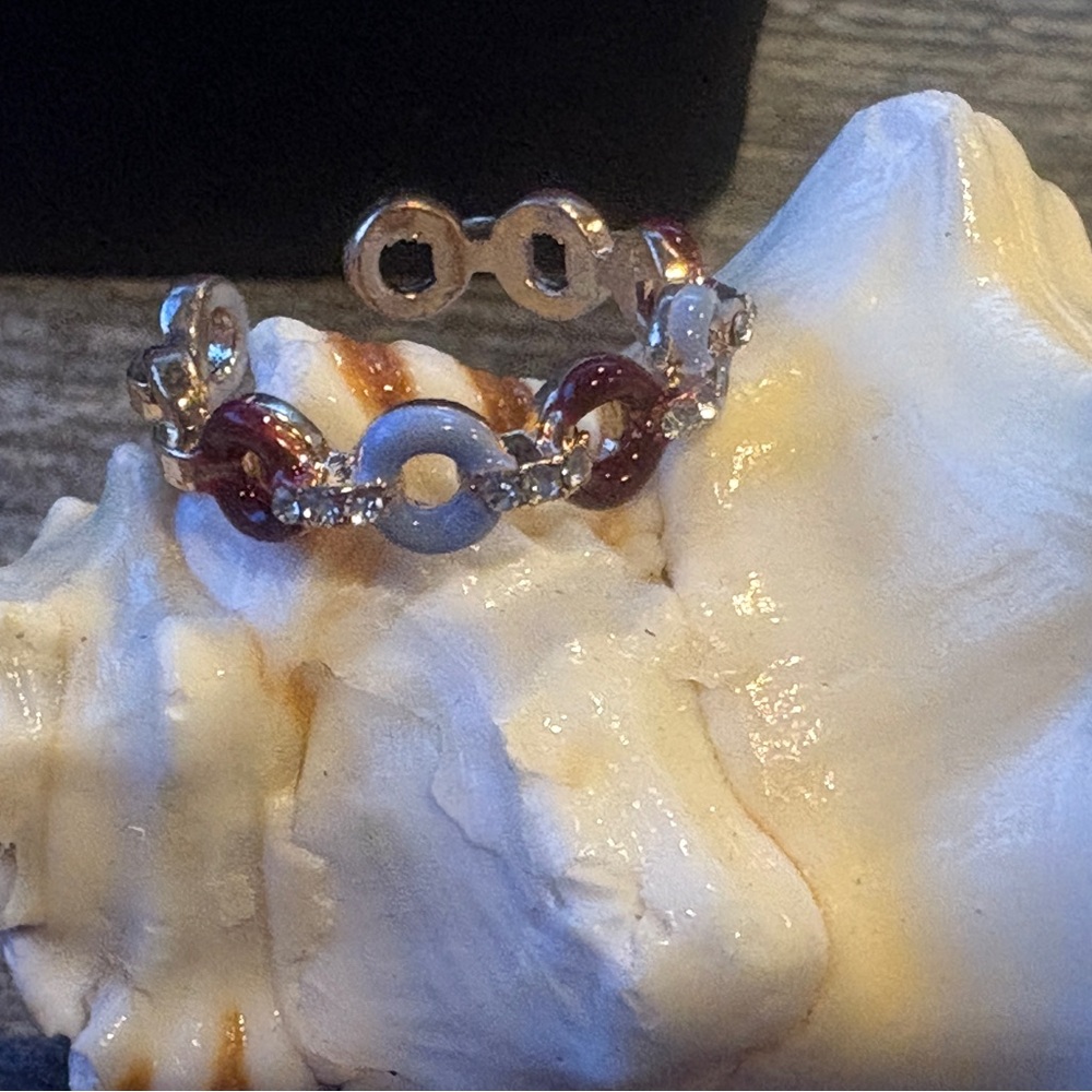 New,  Silver tone ceramic coated donut ring. Lilac blue and cranberry